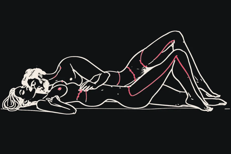 A couple together on a bed