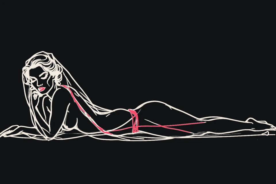 A woman draped in a veil lies on her side