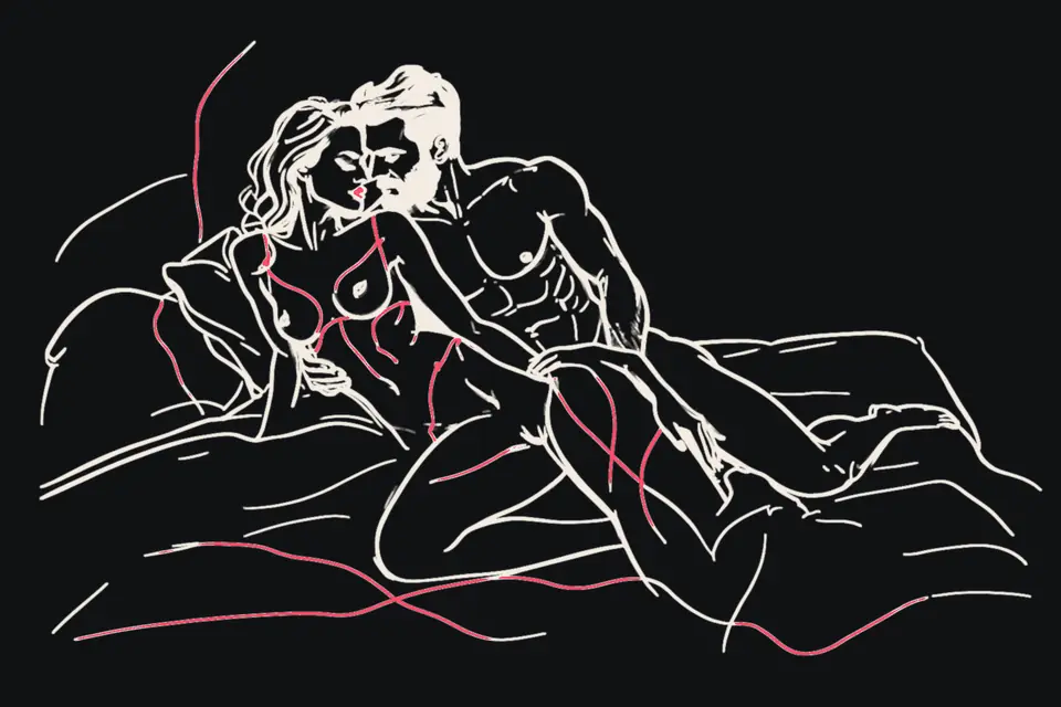 A couple in a close embrace on a bed